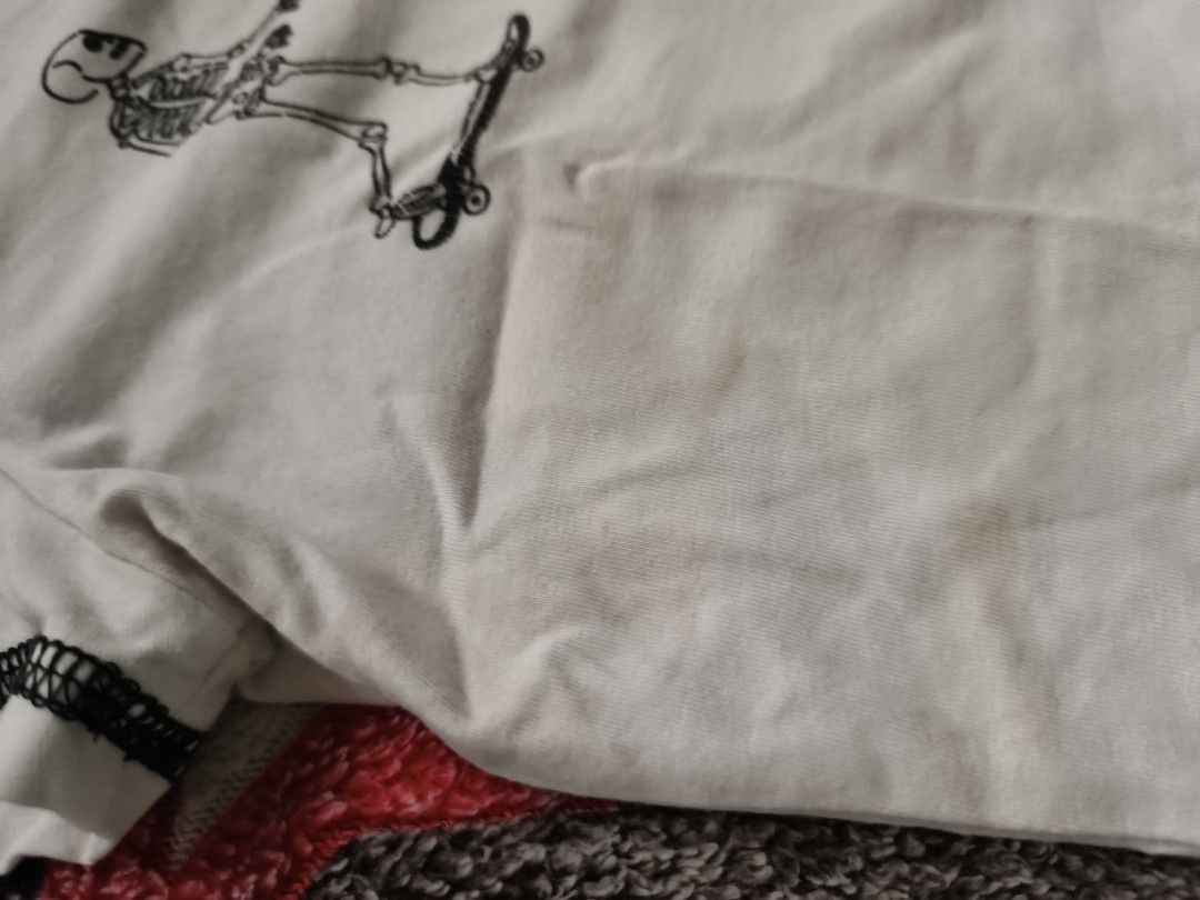 Skating Skeletons Graphic Crop Tee (Category: Shirts) located in Cebu City. Submitted by straw.berry.milk.24 (Listing ID 1462647744, Image 2). Description: - White crop top - Graphic print: Skeletons skateboarding - Short sleeves with contrast stitching - Size: Small - Condition: Some faint stains (please check photos for details).