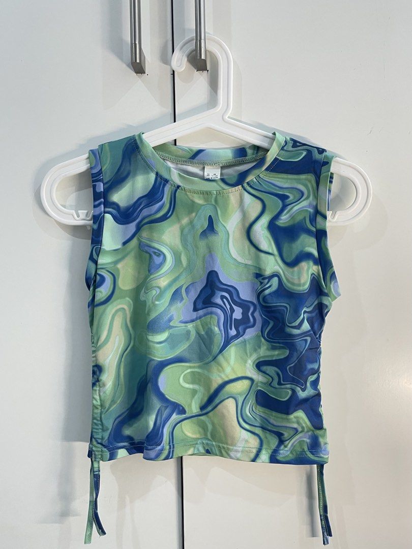 Sleeveless green and blue marble top (Category: Sleeveless) located in Manila. Submitted by raine.star (Listing ID 1462508274, Image 1). Description: Sleeveless, green and blue marble design, ribbed and cropped.