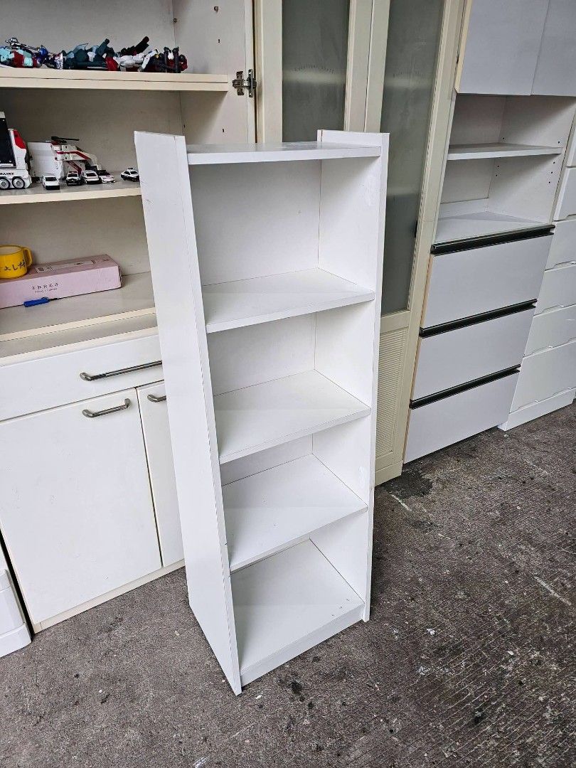 Slim book shelf (Category: Shelves, Cabinets & Racks) located in Meycauayan. Submitted by marygracecasimiro (Listing ID 1462616145, Image 2). Description: Slim Bookshelf ‼️₱2,500‼️ ✔️L-16 H-47.5 W-11.5 inches 📐 ✔️Laminated 🔖 ✔️Compress & Mdf Back 🪵 ✔Scratches As-is! 👌🧡💙.