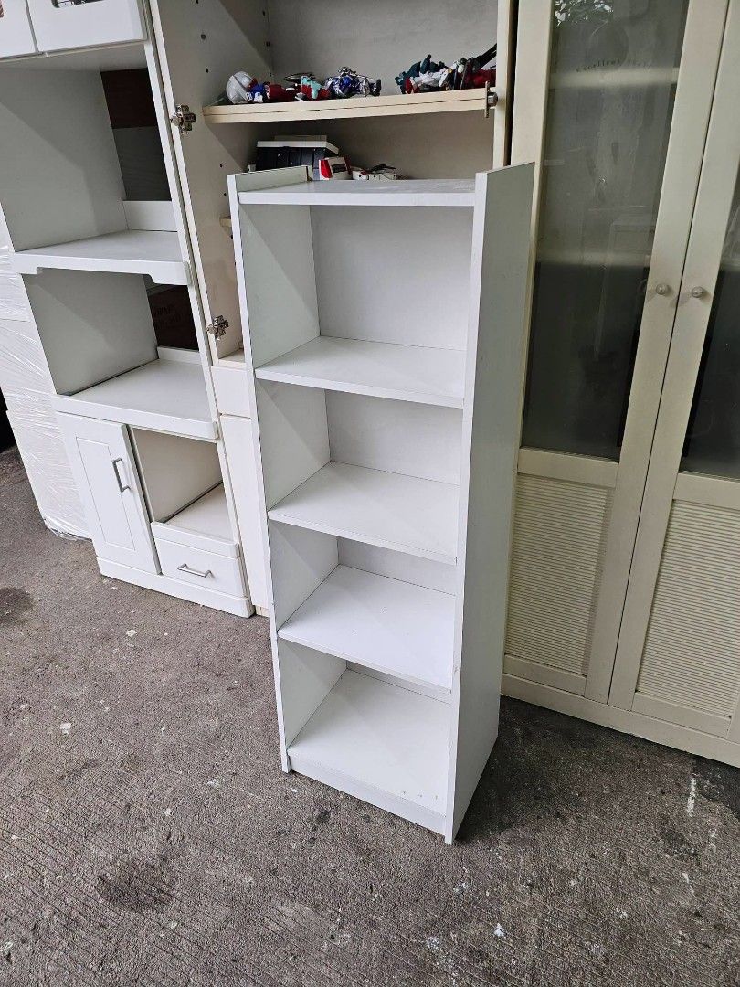 Slim book shelf (Category: Shelves, Cabinets & Racks) located in Meycauayan. Submitted by marygracecasimiro (Listing ID 1462616145, Image 3). Description: Slim Bookshelf ‼️₱2,500‼️ ✔️L-16 H-47.5 W-11.5 inches 📐 ✔️Laminated 🔖 ✔️Compress & Mdf Back 🪵 ✔Scratches As-is! 👌🧡💙.