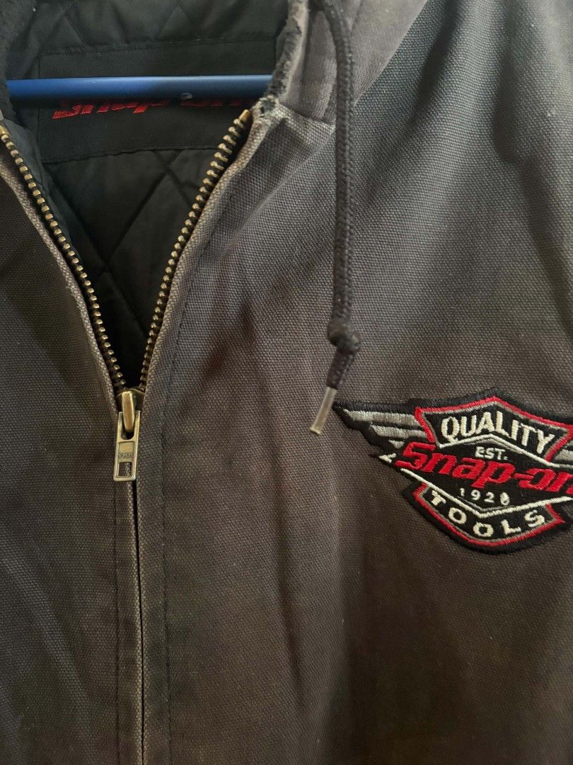 Snap-on Tools Work Jacket Hooded Zip Up (Category: Coats, Jackets and Outerwear) located in Manila. Submitted by shanmichaelkho27 (Listing ID 1462470793, Image 2). Description: - Snap-on Tools work jacket - Features a hood and zip-up front - Embroidered Snap-on logo on the chest - Quilted lining for added warmth - Durable YKK zipper - Ideal for both work and casual wear.