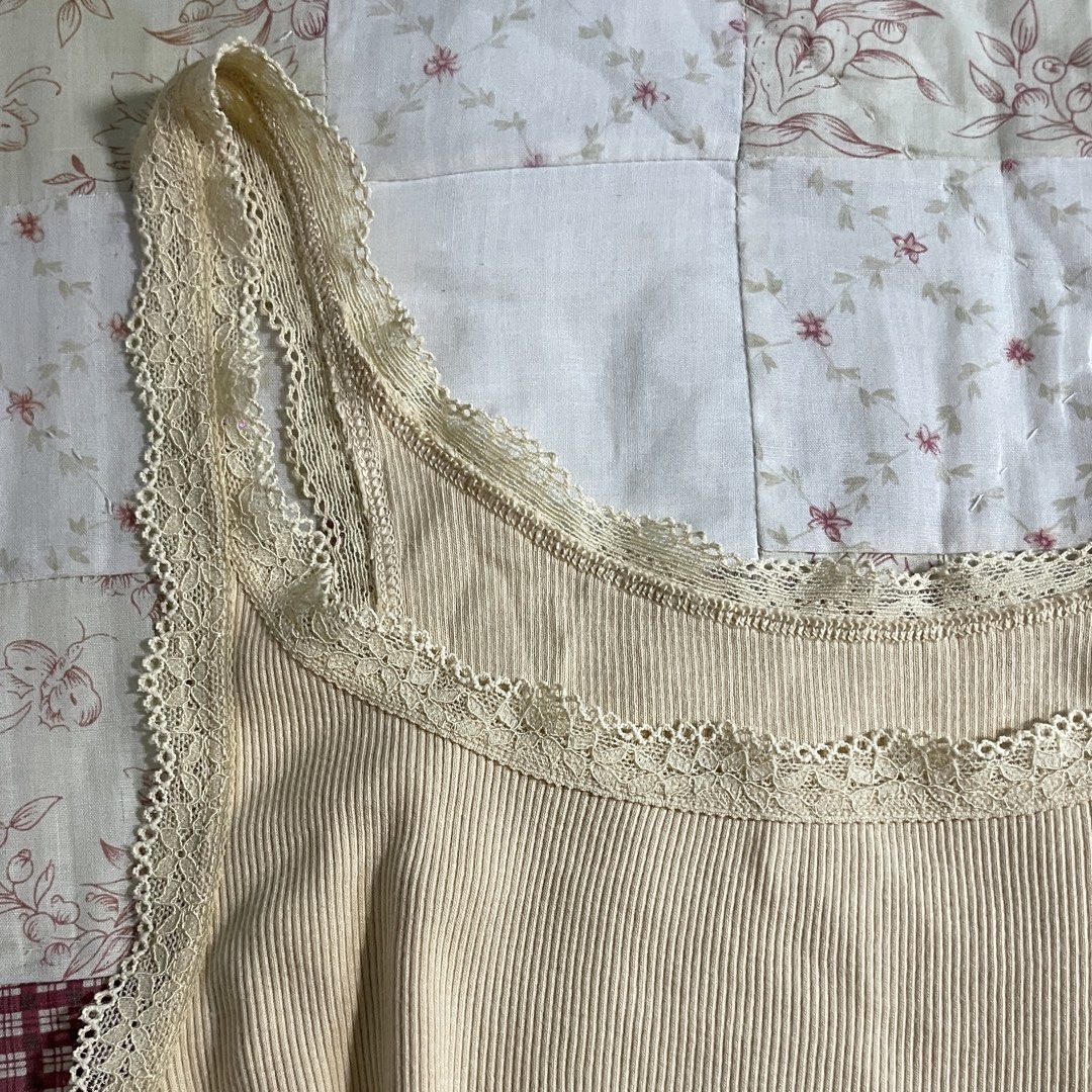 Soft yellow cream colored lace sando top (Category: Sleeveless) located in Baguio. Submitted by emira.seoul (Listing ID 1462518584, Image 2). Description: - no flaws - like new condition - xs to m - cute basic - washed and ready to use ᥫ᭡.ִֶָ𓂃.