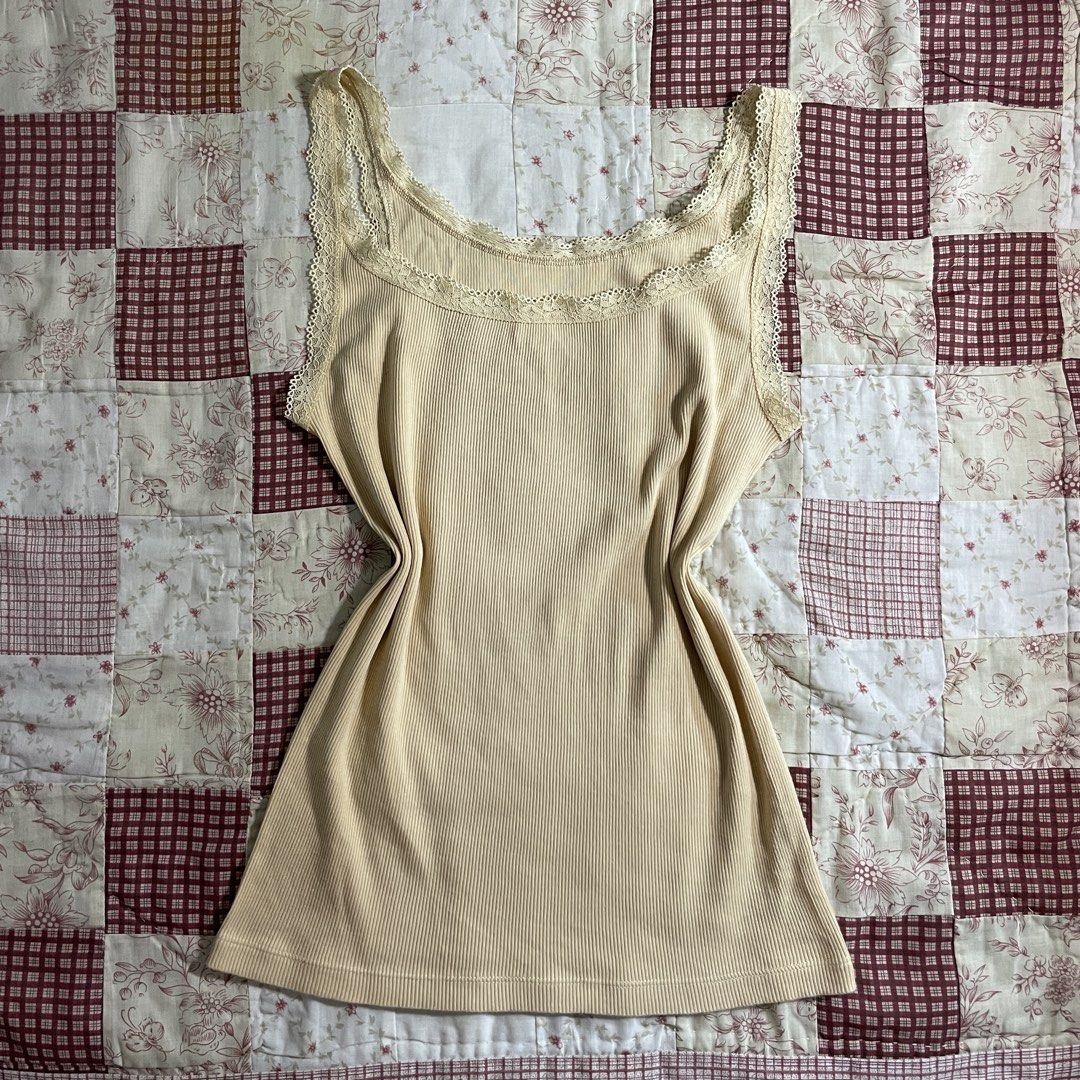 Soft yellow cream colored lace sando top (Category: Sleeveless) located in Baguio. Submitted by emira.seoul (Listing ID 1462518584, Image 1). Description: - no flaws - like new condition - xs to m - cute basic - washed and ready to use ᥫ᭡.ִֶָ𓂃.