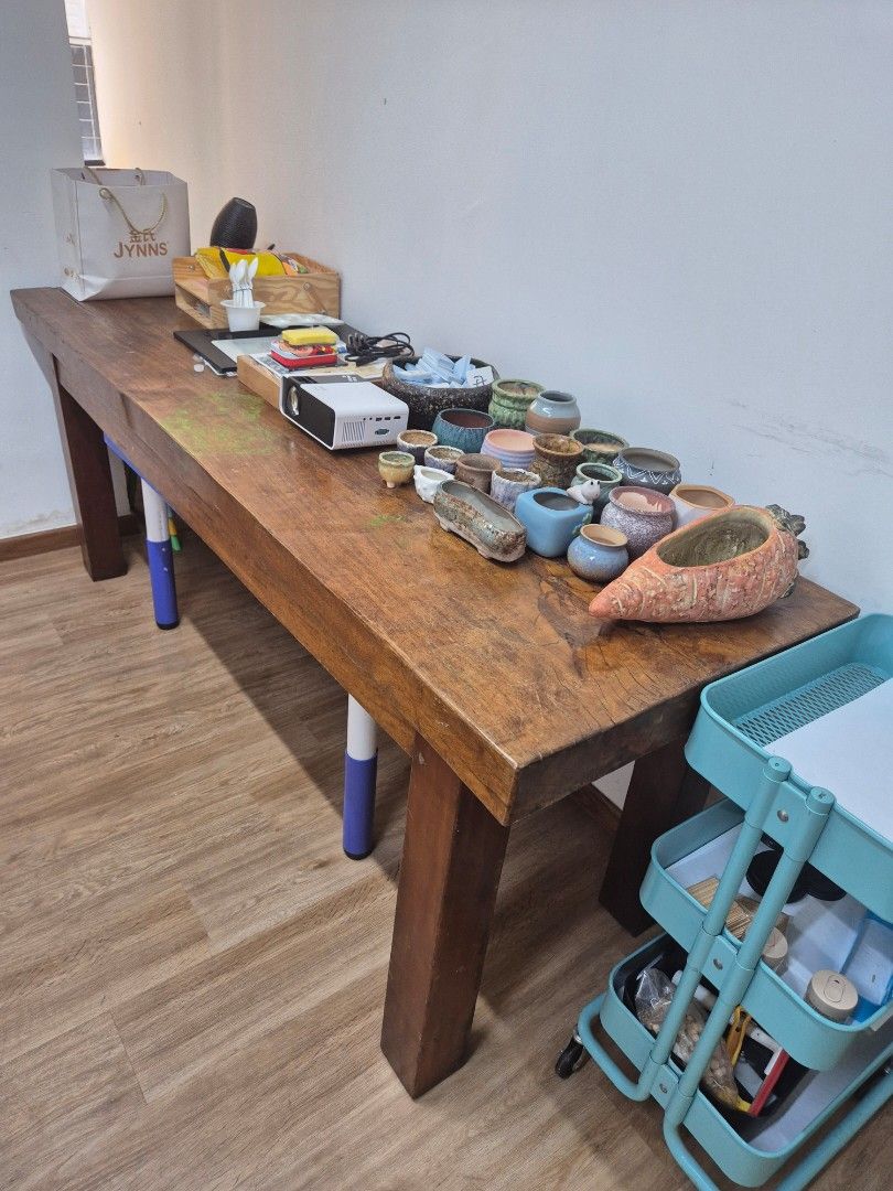 Solid Timber Table (Category: Tables & Sets) located in Singapore. Submitted by kimhoecorporationleasing (Listing ID 1462528145, Image 1). Description: - Solid Timber Table - Well used - 205cm long x 65cm wide x 80cm high.