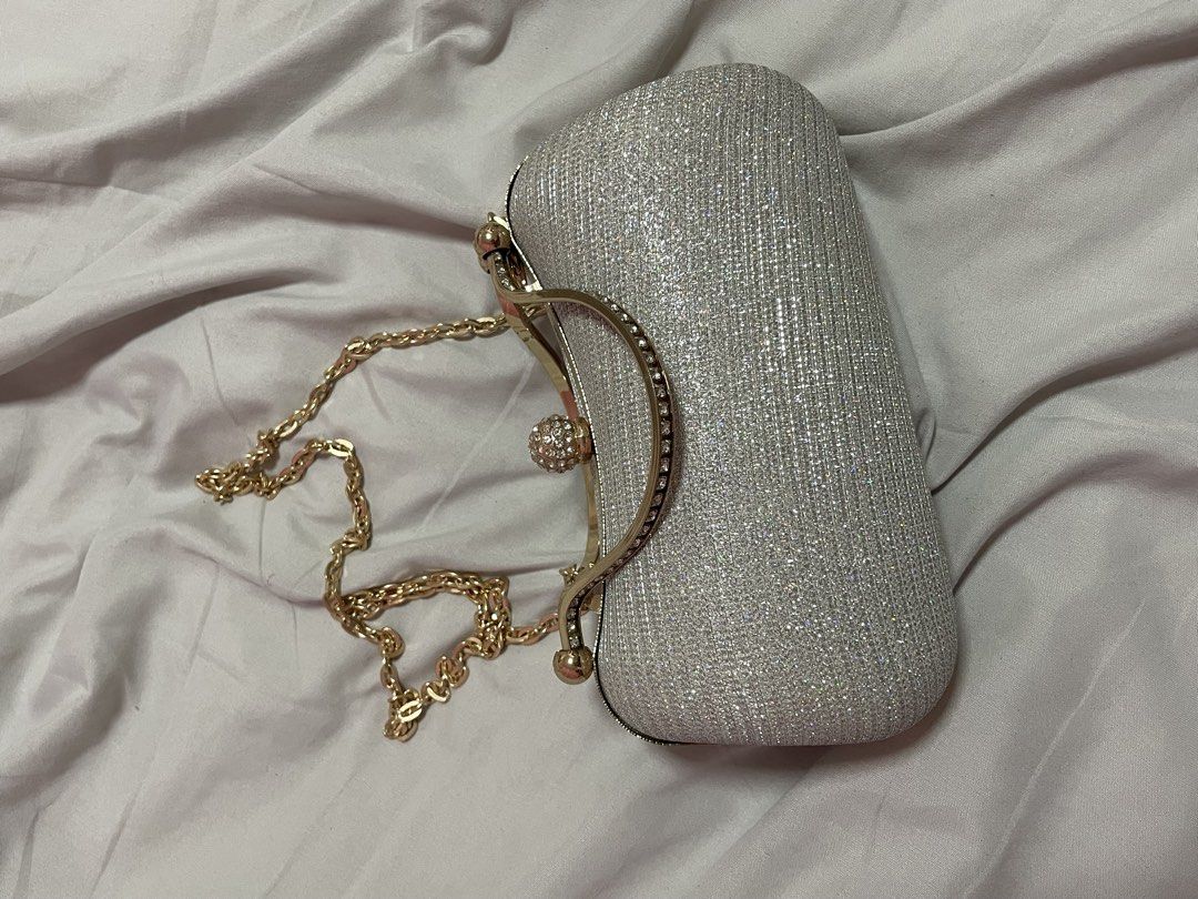 Sparkly Silver Clutch Bag with Gold Chain (Category: Clutches) located in Manila. Submitted by roxyqk (Listing ID 1462470610, Image 1). Description: - Used once for prom - Non negotiable! - Good as new rfs: genuinely need more space on my closet.