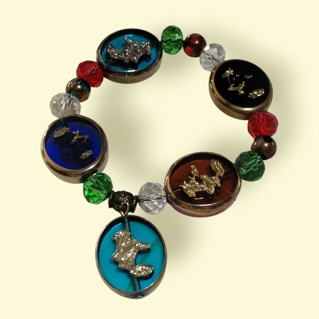 Stained Glass Symphony bracelet (Category: Bracelets) located in San Juan City. Submitted by exclusivelyours (Listing ID 1462466307, Image 1). Description: Bring light and timeless elegance to your collection. Featuring jewel-toned glass cabs, gold details, and faceted crystal beads, this piece captures the vibrant radiance of classic stained glass. Finished with antique brass accents and a charm, it adds a touch of vintage art to any outfit. ▪️ 