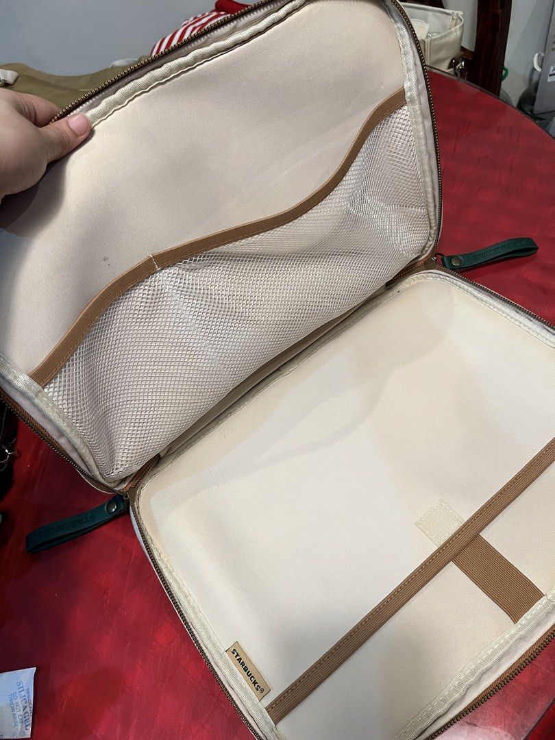 Starbucks Laptop Sleeve Pouch Bag (Category: Laptop Bags & Sleeves) located in Manila. Submitted by harpymonetttt (Listing ID 1462650492, Image 2). Description: - White Starbucks organizer pouch - Features iconic green Starbucks logo - Multiple compartments for organization - Includes a mesh pocket - Elastic straps to secure items - Ideal for tech accessories (cables, chargers, etc.) - Convenient side handle for easy carrying - Fits 15-16 inches 