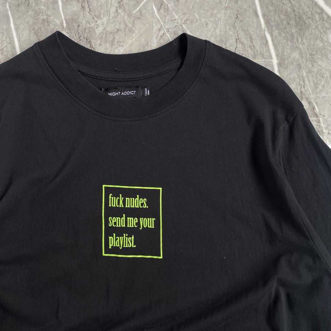 Statement Tee (Category: Tshirts & Polo Shirts ) located in Naga. Submitted by wanderingtreasures.ph1 (Listing ID 1462459382, Image 2). Description: Night Addict “Fck N*des,Send me your playlist” Tee Condition 9.5/10 Color rate 10/10 Large size Width 20-21 / Length 30 No issues php + sf 📩 📍Naga Cebu .