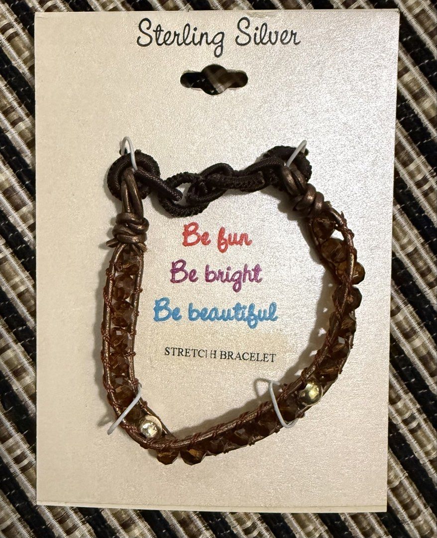 Sterling Silver Stretch Bracelet with Brown Beads (Category: Bracelets) located in Nasugbu. Submitted by truelion.9528cf (Listing ID 1462508237, Image 1). Description: - Cute stretch bracelet - Card reads: "Be fun, be bright, be beautiful" - Adds a touch of sparkle to your outfit - Made in China - Original price: $40.00.