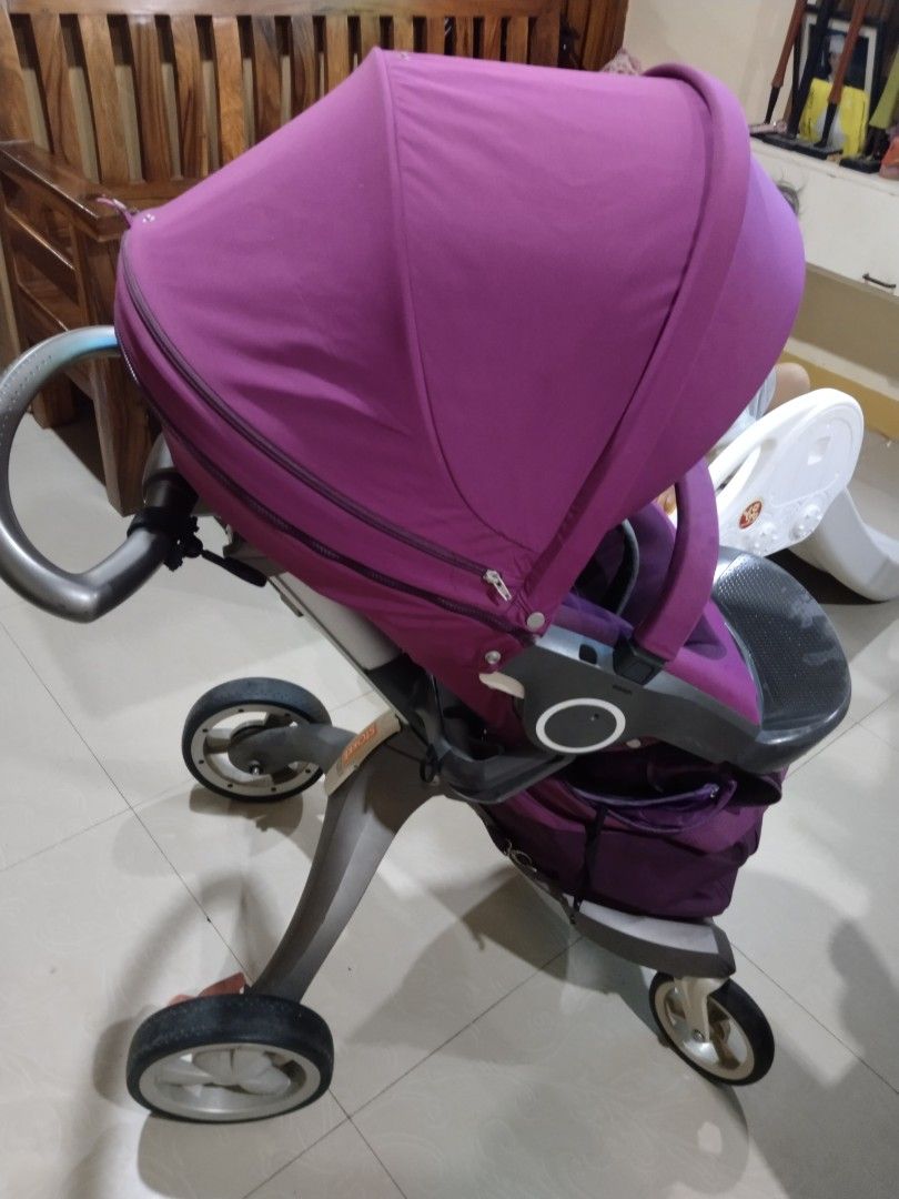 Stokke Stroller - Purple (Category: Strollers) located in Cavite. Submitted by dimple082 (Listing ID 1462499097, Image 1). Description: stokke - Stokke stroller in a lovely purple color. - Comfortable seat for your little one's enjoyment. - Large canopy provides excellent sun protection. - Sturdy wheels ensure smooth and stable rides. - Convenient storage basket underneath for essentials. - Ideal for easy travel and daily outings. - Well-maintain
