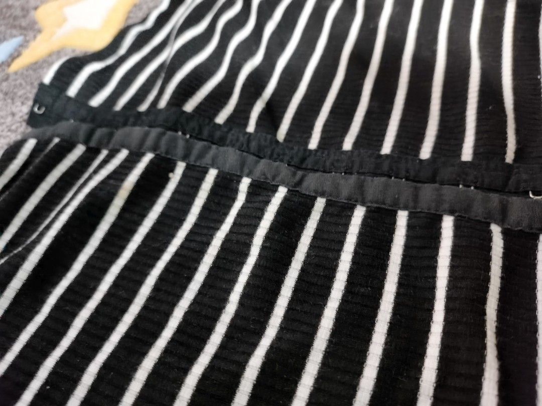 Striped Off-Shoulder Corset Top (Category: Others Tops) located in Cebu City. Submitted by straw.berry.milk.24 (Listing ID 1462647360, Image 2). Description: - Trendy black and white striped pattern - Stylish off-shoulder design - Long sleeves for added coverage - Corset-style front with secure hook and eye closure - Stretchy fabric for a comfortable fit - Fits sizes Small to Medium (S-M) - Versatile: dress it up for a night out or down for casua