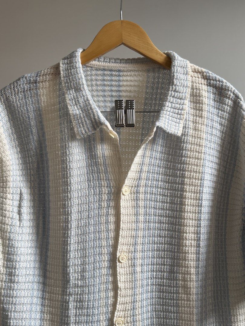 Striped Short Sleeve Button-Up Shirt (Category: Tshirts & Polo Shirts ) located in Cavite. Submitted by toshiakihabara (Listing ID 1462465073, Image 2). Description: - Lightweight short-sleeve shirt - Classic striped pattern - Collared neckline - Button-up front - Textured fabric weave - Versatile for casual wear or layering - Pairs well with shorts or pants.