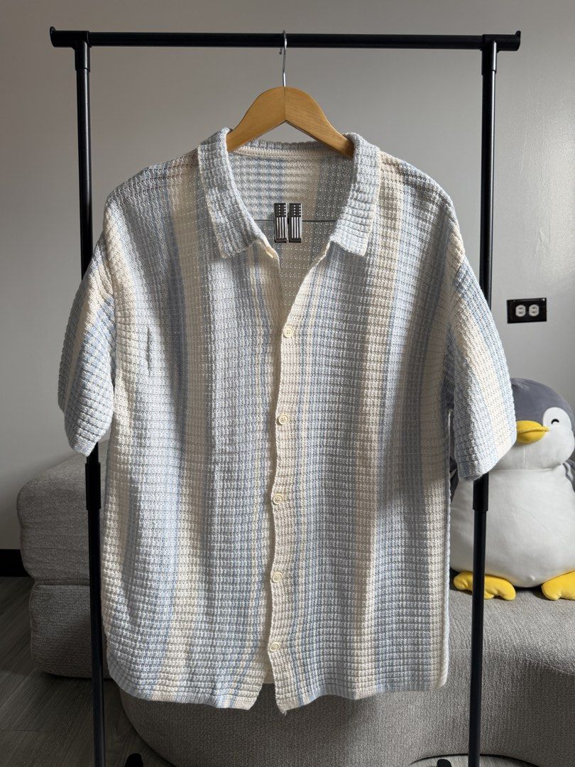 Striped Short Sleeve Button-Up Shirt (Category: Tshirts & Polo Shirts ) located in Cavite. Submitted by toshiakihabara (Listing ID 1462465073, Image 1). Description: - Lightweight short-sleeve shirt - Classic striped pattern - Collared neckline - Button-up front - Textured fabric weave - Versatile for casual wear or layering - Pairs well with shorts or pants.