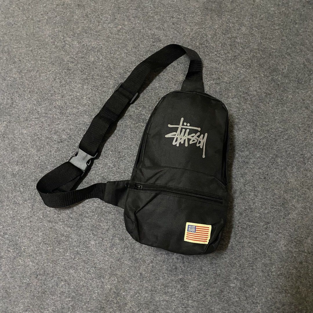 Stussy Black Sling Bag with American Flag Patch (Category: Sling Bags) located in Cebu City. Submitted by callmejasonx (Listing ID 1462564628, Image 1). Description: - Black Stussy sling bag - Features Stussy logo on the front - 'Stussy Troops' American flag patch - Main compartment with two internal pockets - Adjustable strap for comfortable wear - Ideal for everyday use -Authentic Magazine Bag.