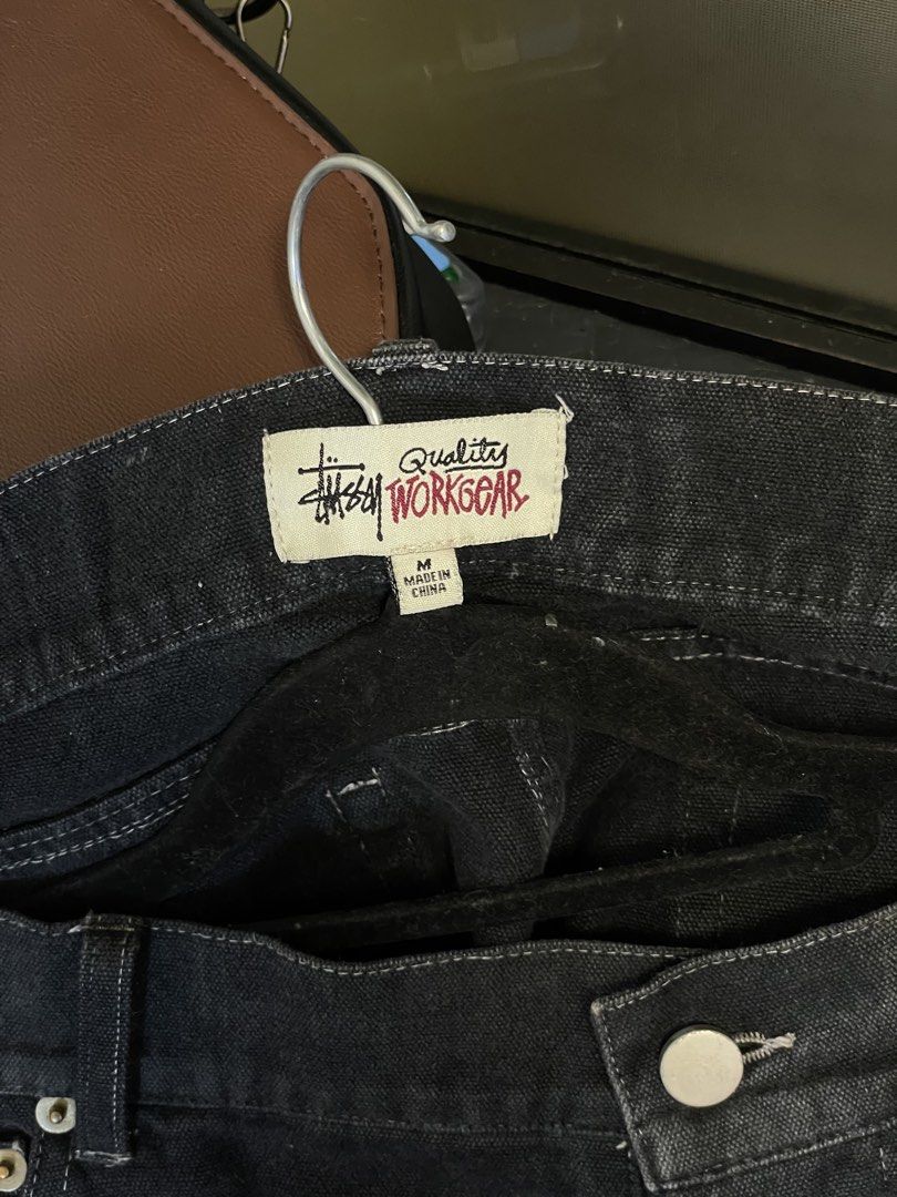 Stussy Workgear Jeans Size M (Category: Jeans) located in Manila. Submitted by cis_thrift143 (Listing ID 1462533672, Image 2). Description: - Stussy Workgear Jeans - Color: Black - Size: Medium (M) - Features: Classic Stussy logo, 'Equipment for the Modern Age' print, 8-ball graphic - Origin: Made in China - Ideal for: Casual wear.