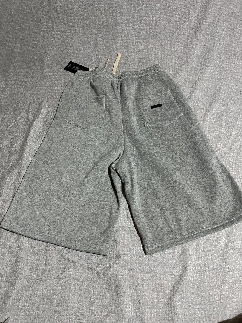 SUMWON Drop Crotch Essential Shorts Jogger Style Grey (Category: Shorts) located in Manila. Submitted by az0r_ (Listing ID 1462503004, Image 2). Description: - Grey SUMWON drop crotch shorts - Jogger style with drawstring waist - Comfortable and casual - Perfect for everyday wear.