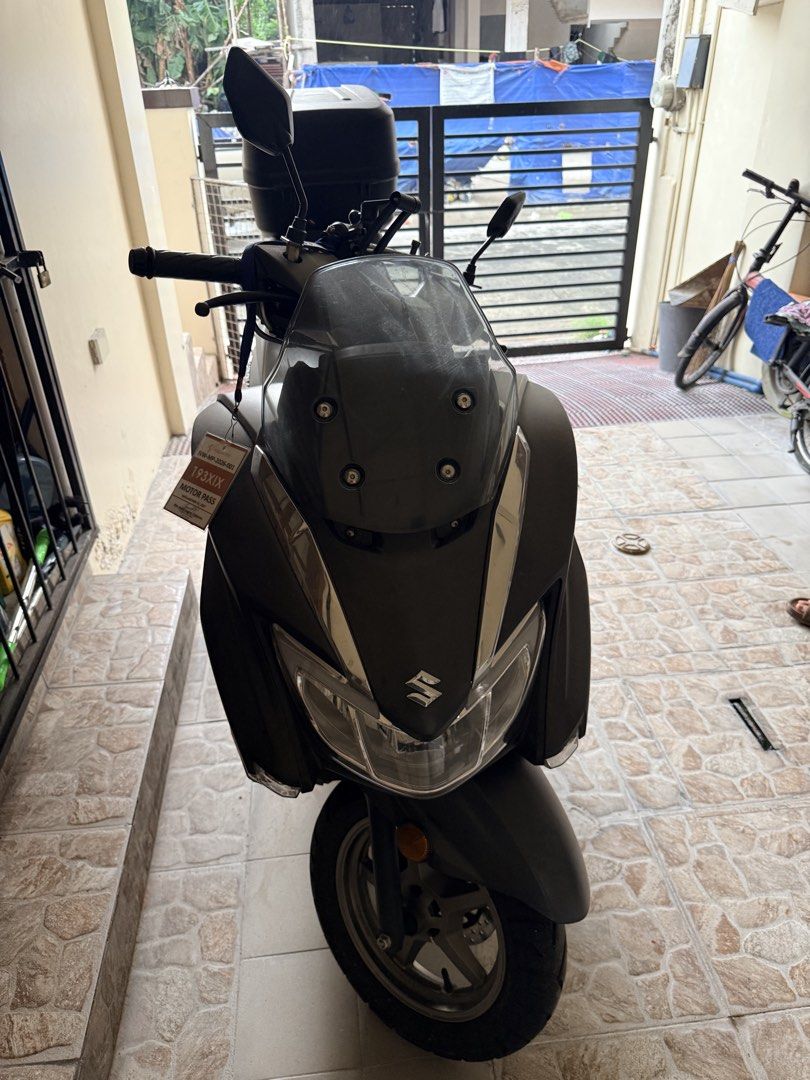 Suzuki Burgman 125 Scooter (Category: Motorbikes for Sale) located in Taguig. Submitted by barorep (Listing ID 1462450050, Image 3). Description: Burgman Street EX 125 2024 mileage 5k only with original GIVI box (no key) westlake tire 120/70-12 FRONT 130/70-12 REAR ♦️Price still negotiable for sure buyer♦️ - Registered until 2026 - stock pipe & grab bar still with me - with minor scratch sa left side bumagsak sa parking pero walang basag - no acc