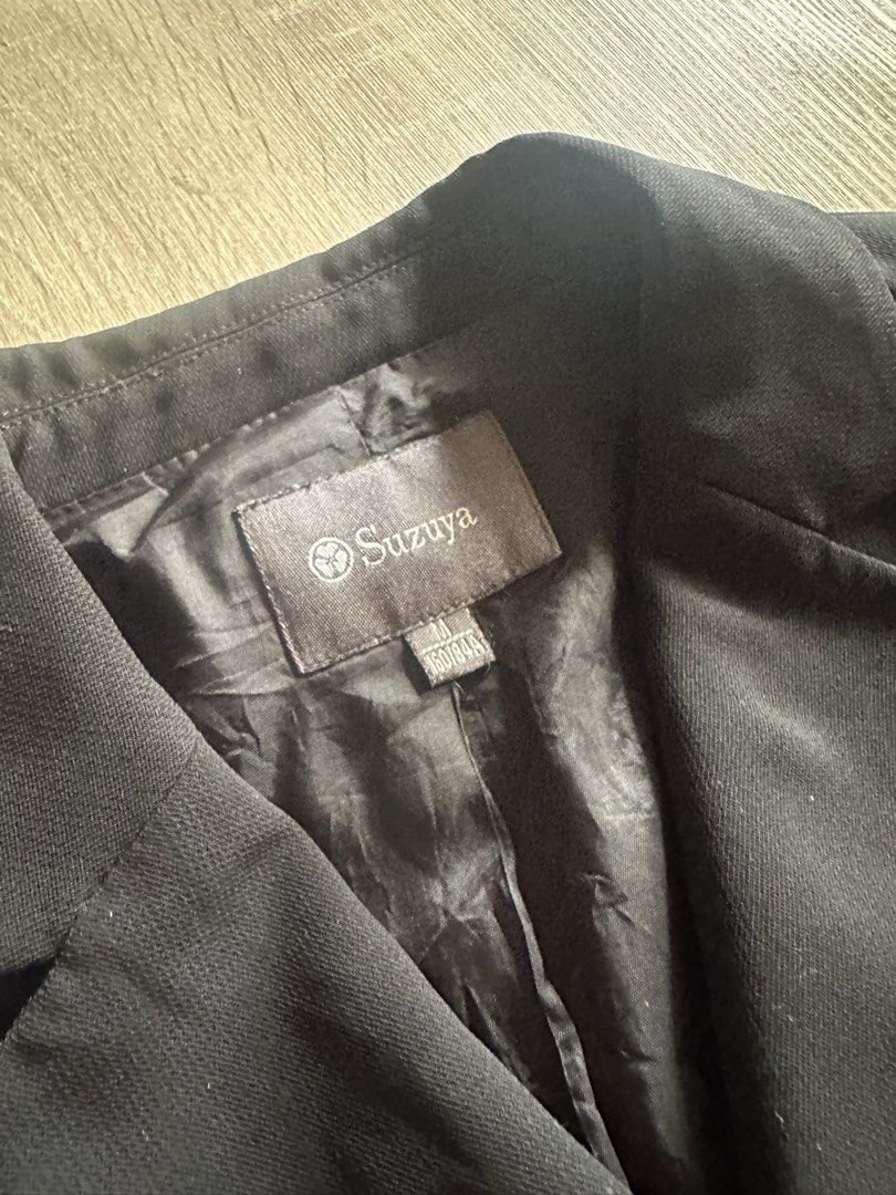 Suzuya Black Blazer Jacket Size M (Category: Coats, Jackets and Outerwear) located in Cainta. Submitted by thingsfromerika (Listing ID 1462473893, Image 3). Description: - Classic black blazer from Suzuya - Features a lapel and button-up front - Decorative buttons with a unique floral design - Fully lined interior for comfort - Ideal for both workwear and smart casual outfits - Measurements available upon request.