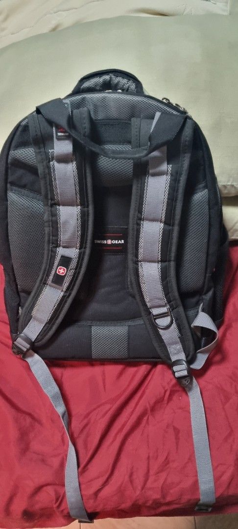 Swiss Gear Backpack - Black (Category: Backpacks) located in Manila. Submitted by ags028705 (Listing ID 1462583978, Image 2). Description: - Swiss Gear backpack - Multiple compartments for organization - Padded straps for comfort - Dedicated 'Triple Protect' laptop section - Intact and functional zippers - Ample space for essentials - Ideal for school or travel.