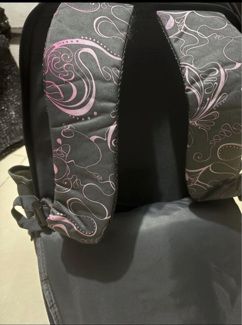 Technopack Rolling Backpack with Wheels and Cute Bear Charm (Category: Backpacks) located in Batangas. Submitted by jmo1025 (Listing ID 1462447592, Image 3). Description: - Cool Technopack rolling backpack - Dark grey with a pink swirl pattern - Wheels and retractable handle for easy transport - Padded shoulder straps for comfortable carrying - Comes with a cute bear charm - Plenty of space inside for books and essentials.