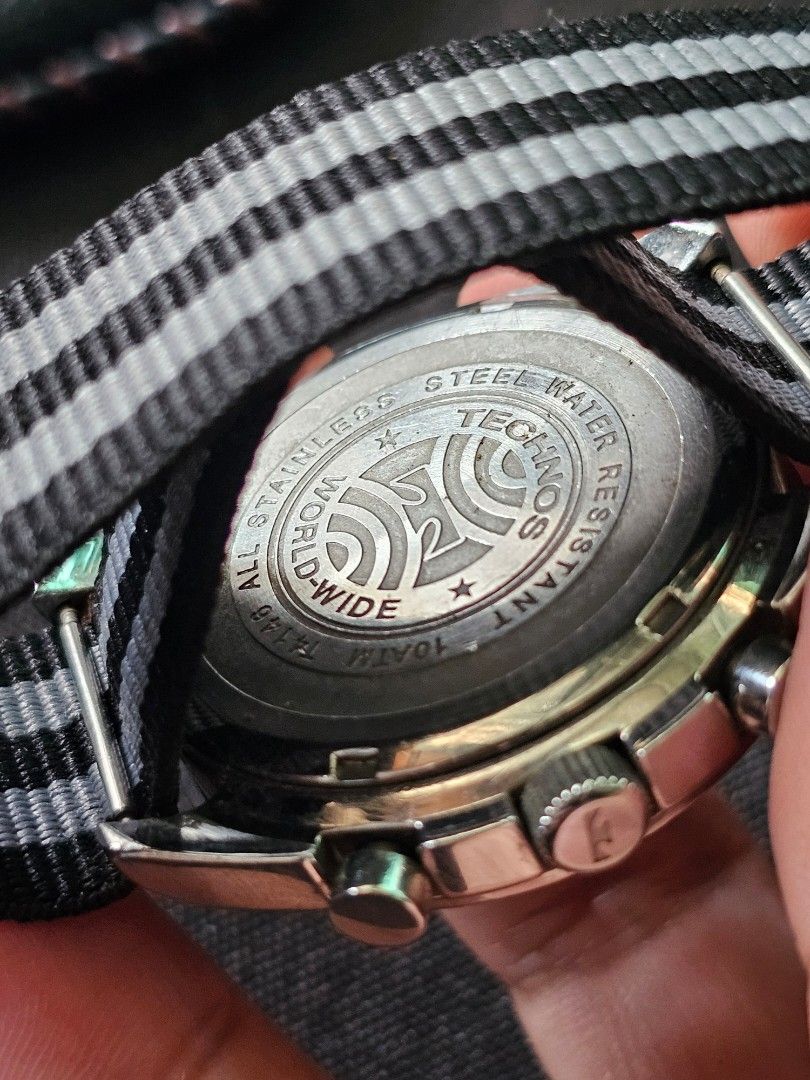 Technos t4146 Steel Water Resistant Watch (Category: Men's Watches) located in Manila. Submitted by rafmigz.fire (Listing ID 1462464820, Image 2). Description: - Technos World-Wide Chronograph Watch - Durable Steel Case - Water Resistant up to 10 ATM - Classic Black Dial with White Hands & Markers - Comfortable Black & Grey Striped NATO Strap - Ideal for Everyday Wear -Quartz Movement -Omega Speedmaster Homage ISSUE: -Chronograph not working. pwe