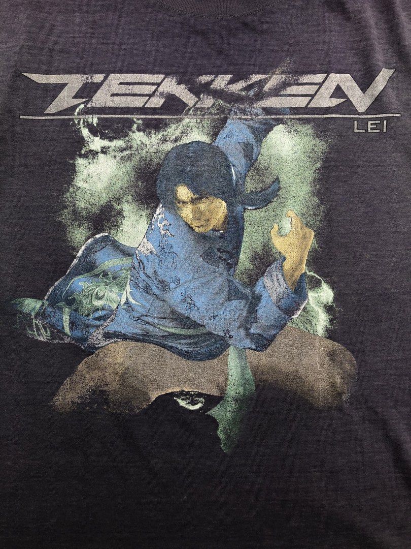 TEKKEN (Category: Tshirts & Polo Shirts ) located in Manila. Submitted by thrift_neo (Listing ID 1462612007, Image 3). Description: TEKKEN “LEI” missing tag dimes 19x24.5 issue:fade shirt, graphic fadinf, repaird 2holes.