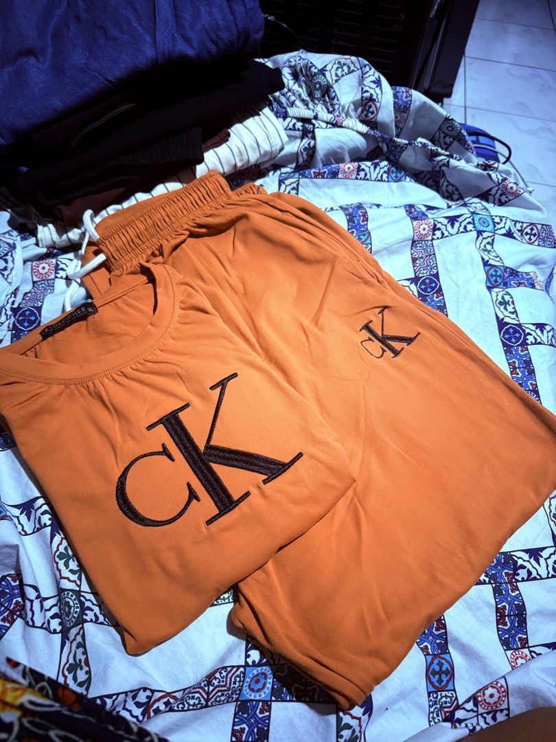 TERNO Set (KUWAIT) (Category: Sets or Coordinates) located in Manila. Submitted by preownedbyyas (Listing ID 1462640023, Image 2). Description: - Comfy teno set: includes t-shirt and pants. - Available colors: Orange and White. - Features embroidered CK logo on both pieces. - Made with soft material for ultimate comfort. - Shorts have an elastic waistband for a great fit. - Ideal for casual days..