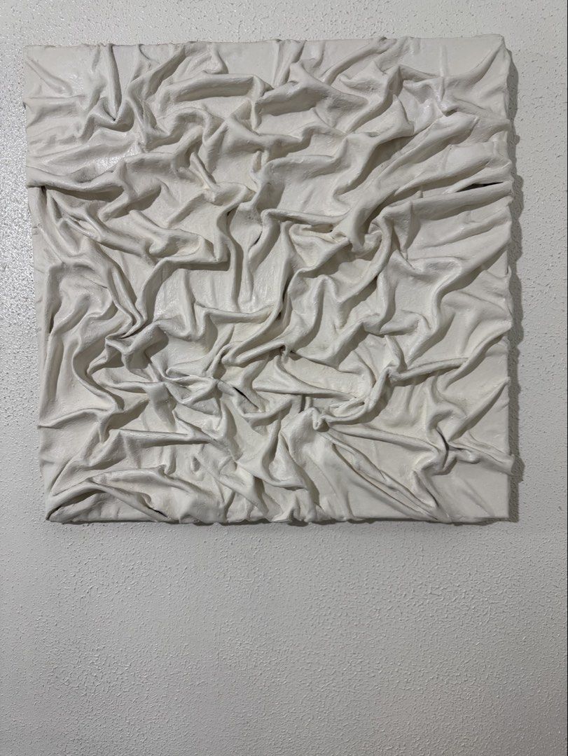 Textured White Fabric Wall Art Canvas (Category: Wall Decor) located in Manila. Submitted by blueginger747 (Listing ID 1462636785, Image 1). Description: - Unique textured wall art piece - White fabric draped and secured on canvas - Adds dimension and visual interest - Neutral color complements various decor styles - Ideal for living room, bedroom, or hallway - 19x19inches.