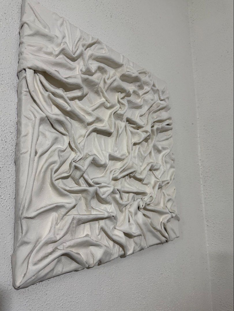 Textured White Fabric Wall Art Canvas (Category: Wall Decor) located in Manila. Submitted by blueginger747 (Listing ID 1462636785, Image 2). Description: - Unique textured wall art piece - White fabric draped and secured on canvas - Adds dimension and visual interest - Neutral color complements various decor styles - Ideal for living room, bedroom, or hallway - 19x19inches.