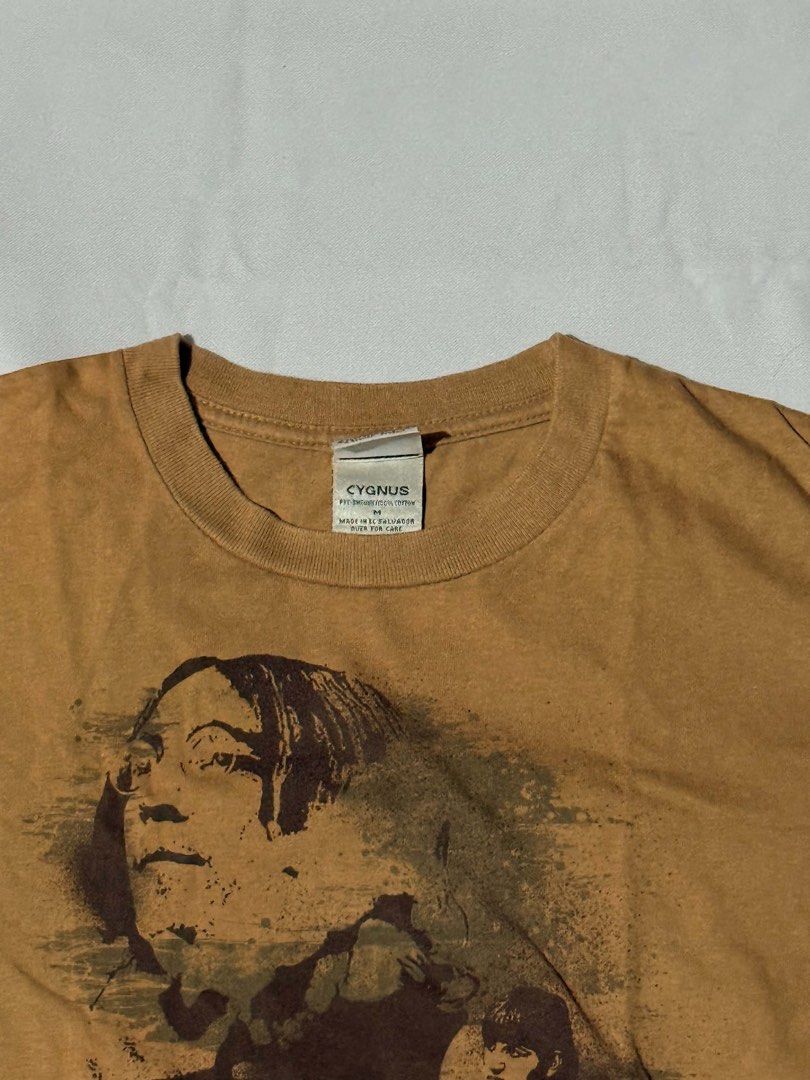 The Beatles Graphic T-Shirt (Category: Tshirts & Polo Shirts ) located in Manila. Submitted by simply.z.mnl (Listing ID 1462552424, Image 2). Description: - Brown t-shirt with a cool graphic print of The Beatles. - Made from 100% comfortable and breathable cotton. - Stylish and perfect for any Beatles fan..