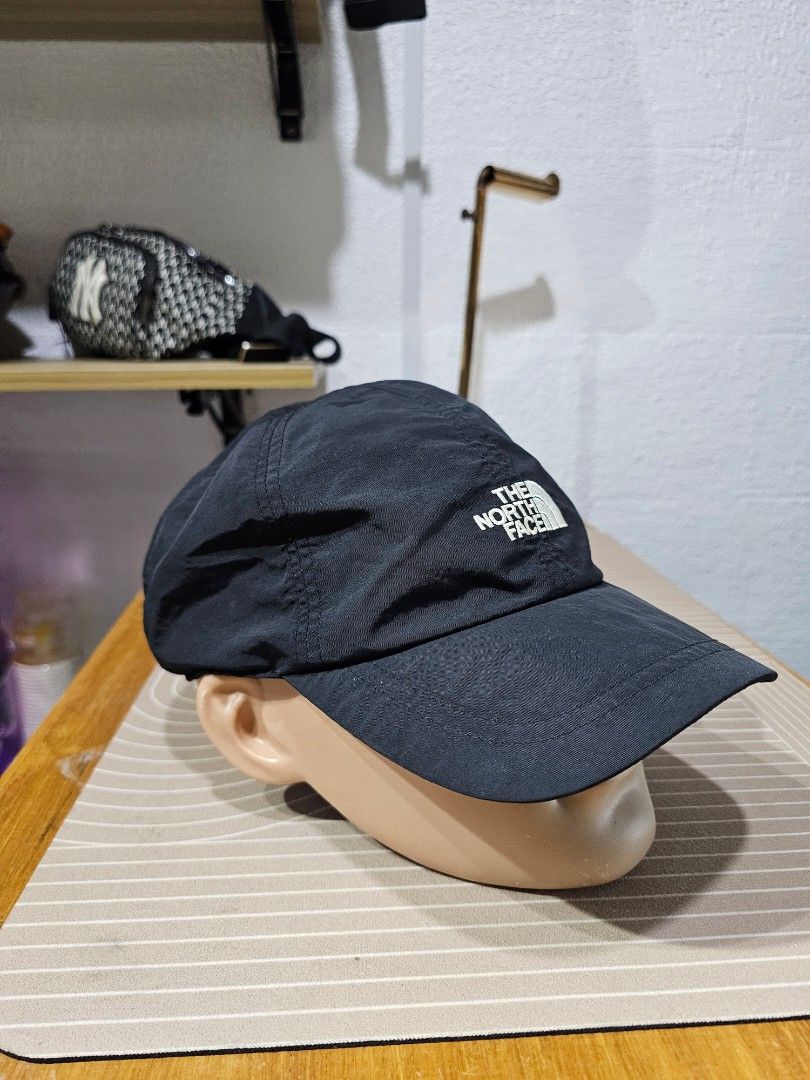 The North Face Black Cap (Category: Caps & Hats) located in Baguio. Submitted by kayeonlineshop (Listing ID 1462549722, Image 2). Description: -black nylon baseball cap from The North Face, featuring a contrasting white embroidered logo on the front crown..