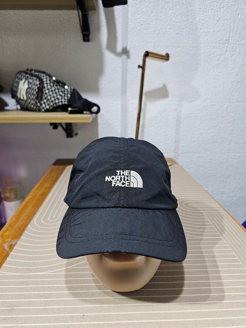 The North Face Black Cap (Category: Caps & Hats) located in Baguio. Submitted by kayeonlineshop (Listing ID 1462549722, Image 1). Description: -black nylon baseball cap from The North Face, featuring a contrasting white embroidered logo on the front crown..