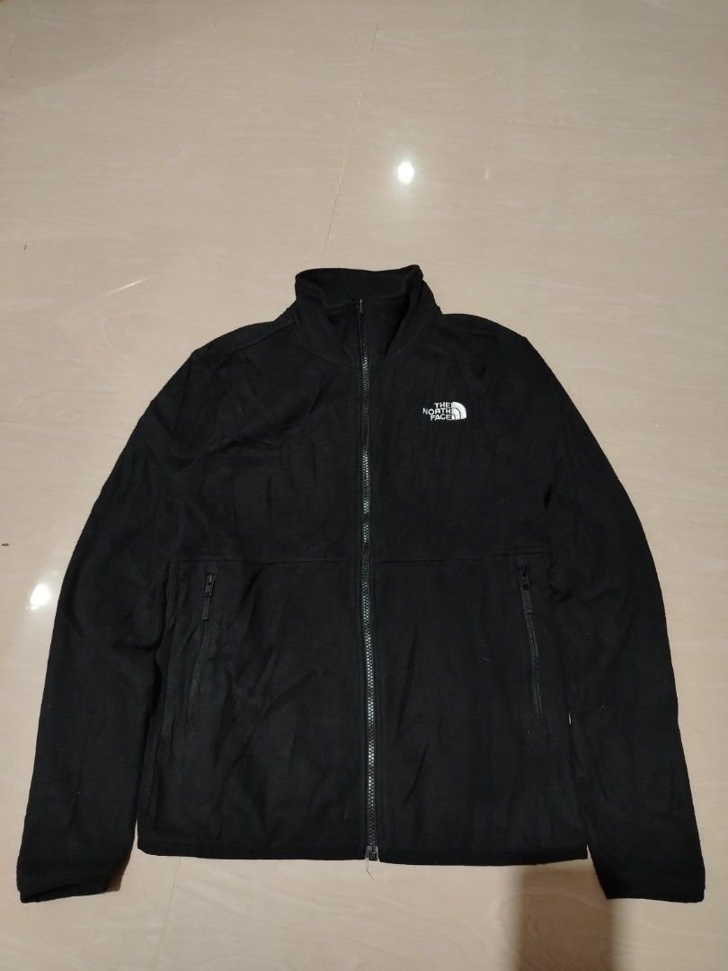 The North Face Black Fleece Jacket (Category: Coats, Jackets and Outerwear) located in Tagum. Submitted by kotasallys40096 (Listing ID 1462577768, Image 1). Description: - Brand: The North Face - Color: Black - Style: Fleece Jacket - Closure: Full zip - 20*26 - Pockets: Two zip pockets - Collar: Stand-up collar for extra warmth - Material: 100% Polyester - Care: Easy to care for - Versatile: Great for layering or wearing on its own.
