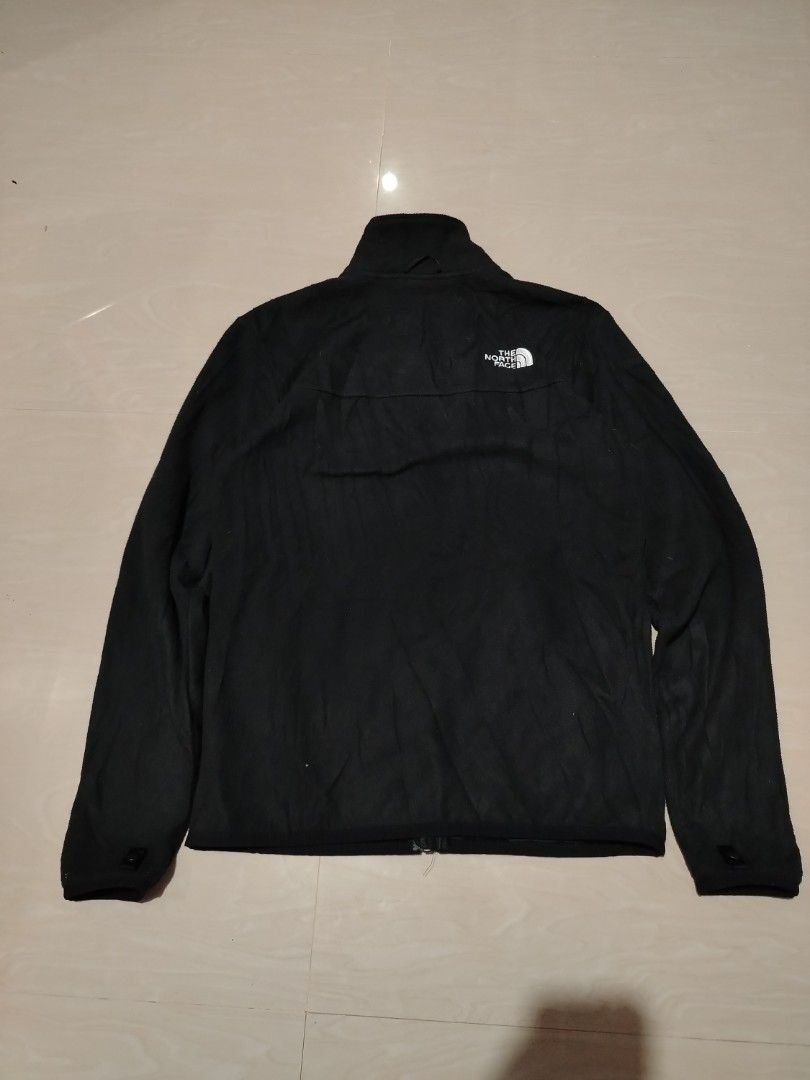The North Face Black Fleece Jacket (Category: Coats, Jackets and Outerwear) located in Tagum. Submitted by kotasallys40096 (Listing ID 1462577768, Image 2). Description: - Brand: The North Face - Color: Black - Style: Fleece Jacket - Closure: Full zip - 20*26 - Pockets: Two zip pockets - Collar: Stand-up collar for extra warmth - Material: 100% Polyester - Care: Easy to care for - Versatile: Great for layering or wearing on its own.