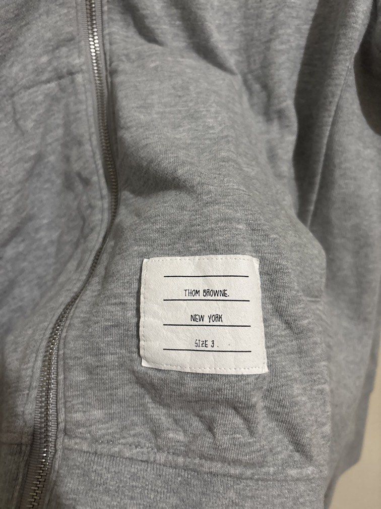 Thom Browne (Category: Hoodies) located in Muntinlupa City. Submitted by owrayttttt (Listing ID 1462553642, Image 2). Description: - Thom Browne Zip up Hoodie - Size 3 on tag - Actual Dimes is 22x28 - Complete tags - Free shipping via j&t.