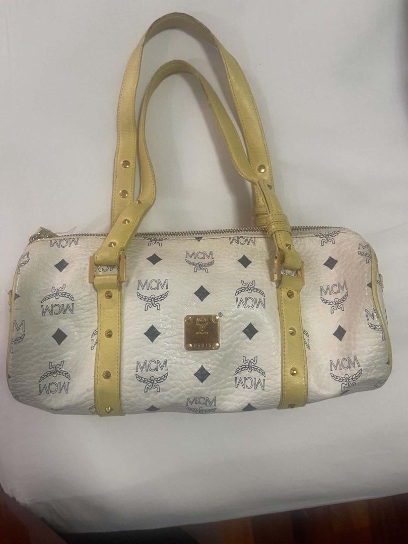 [THRIFTED] MCM Monogram Boston Bag White Yellow Leather (Category: Luxury Bags & Wallets) located in Cainta. Submitted by gamityen (Listing ID 1462492810, Image 2). Description: ‼️ PLEASE READ BEFORE PROCEEDING ‼️ Thrifted authentic MCM Monogram Boston Bag. White with yellow leather trim. All-over MCM logo print. Gold hardware. Zipper closure. Top handles. Shoulder bag. RF: need funds IMPORTANT NOTES: - FREE SHIPPING thru J&T - Does NOT come with