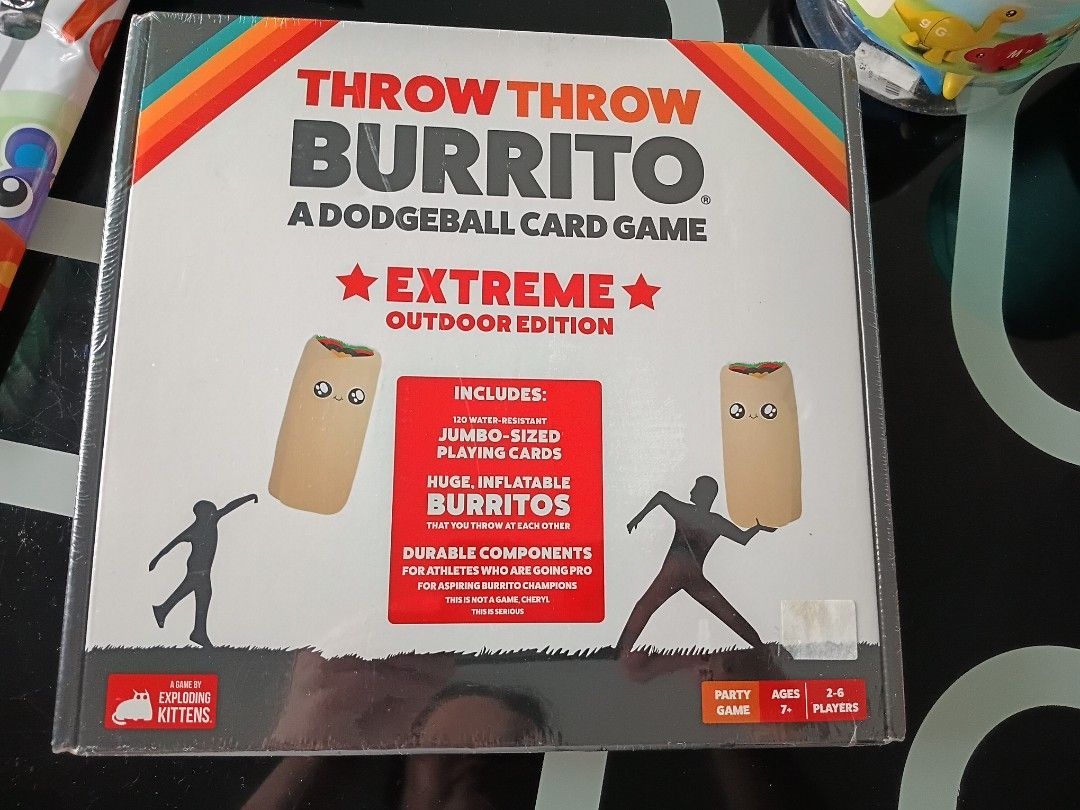 Throw Throw Burrito Extreme Outdoor Edition Card Game (Category: Board Games & Puzzles) located in Binangonan. Submitted by chingtp (Listing ID 1462606841, Image 1). Description: - Dodgeball card game from the creators of Exploding Kittens. - Extreme Outdoor Edition for active play. - Includes 120 water-resistant, jumbo-sized playing cards. - Comes with huge, inflatable burritos. - Durable components built for outdoor fun. - Great for parties and