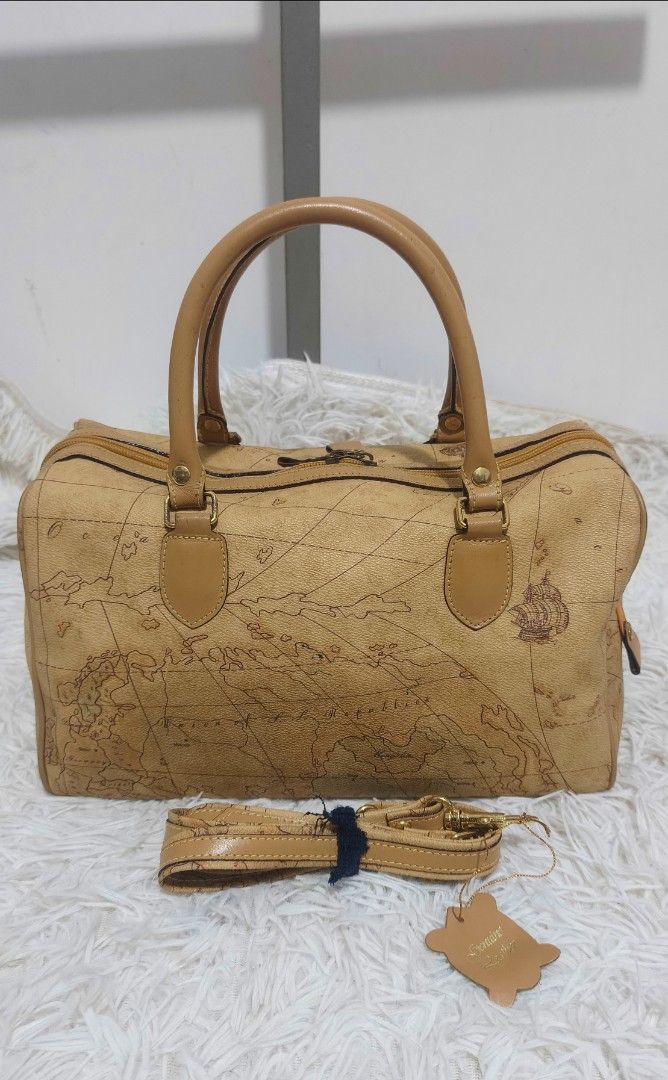 TIARA TWO WAY MAP BAG (Category: Cross-body Bags) located in Kalibo. Submitted by secondchances.thriftsh8p (Listing ID 1462635983, Image 2). Description: - Boston Bag - Iconic map print - Detachable shoulder strap included - Genuine leather trim and handles - Secure zipper closure - Ideal for travel and everyday use - A timeless and stylish accessory.