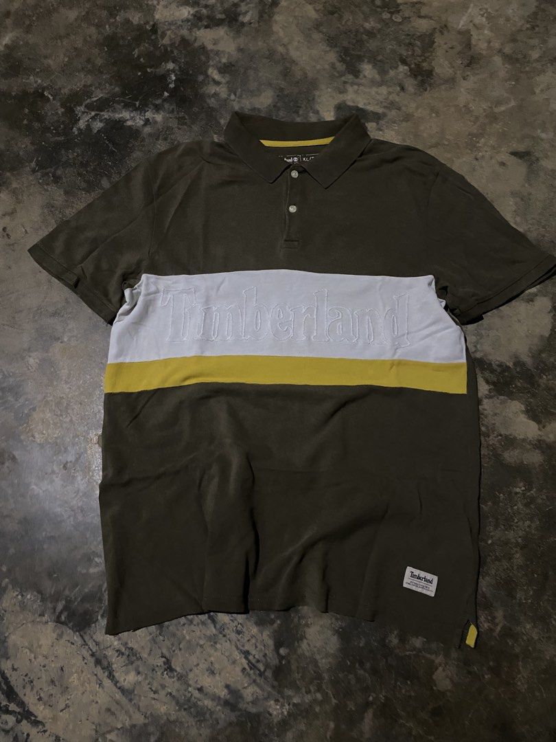 Timberland Polo Shirt XL (Category: Tshirts & Polo Shirts ) located in Caloocan City. Submitted by remythrift (Listing ID 1462609132, Image 1). Description: - Olive green Timberland polo shirt - Size XL - White and yellow stripe across the chest - Embossed Timberland logo detail - Perfect for casual wear - Please check photos for detailed condition.