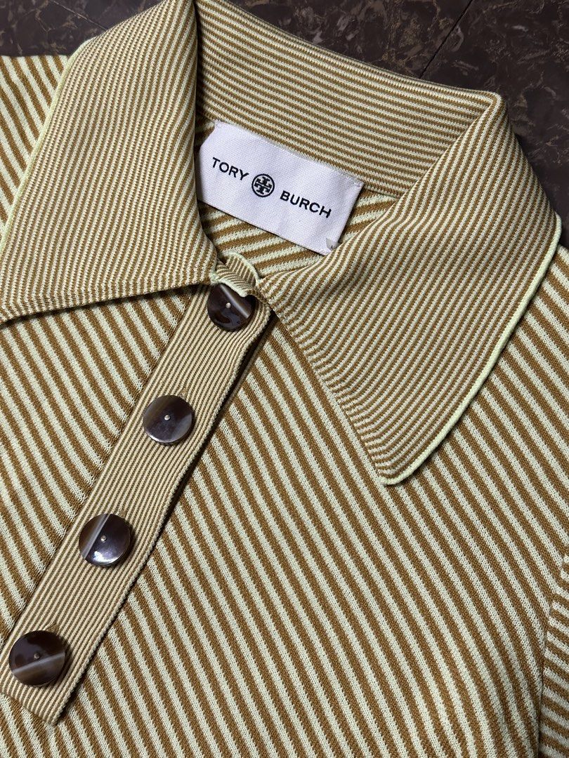 Tory Burch Striped Polo Shirt (Category: Shirts) located in Padada. Submitted by jevanie1234 (Listing ID 1462545136, Image 2). Description: - Tory Burch Polo Shirt - Size: XS - Design: Striped pattern - Features: Collar, button details - Branding: Embroidered Tory Burch logo on sleeve - Origin: Made in China.