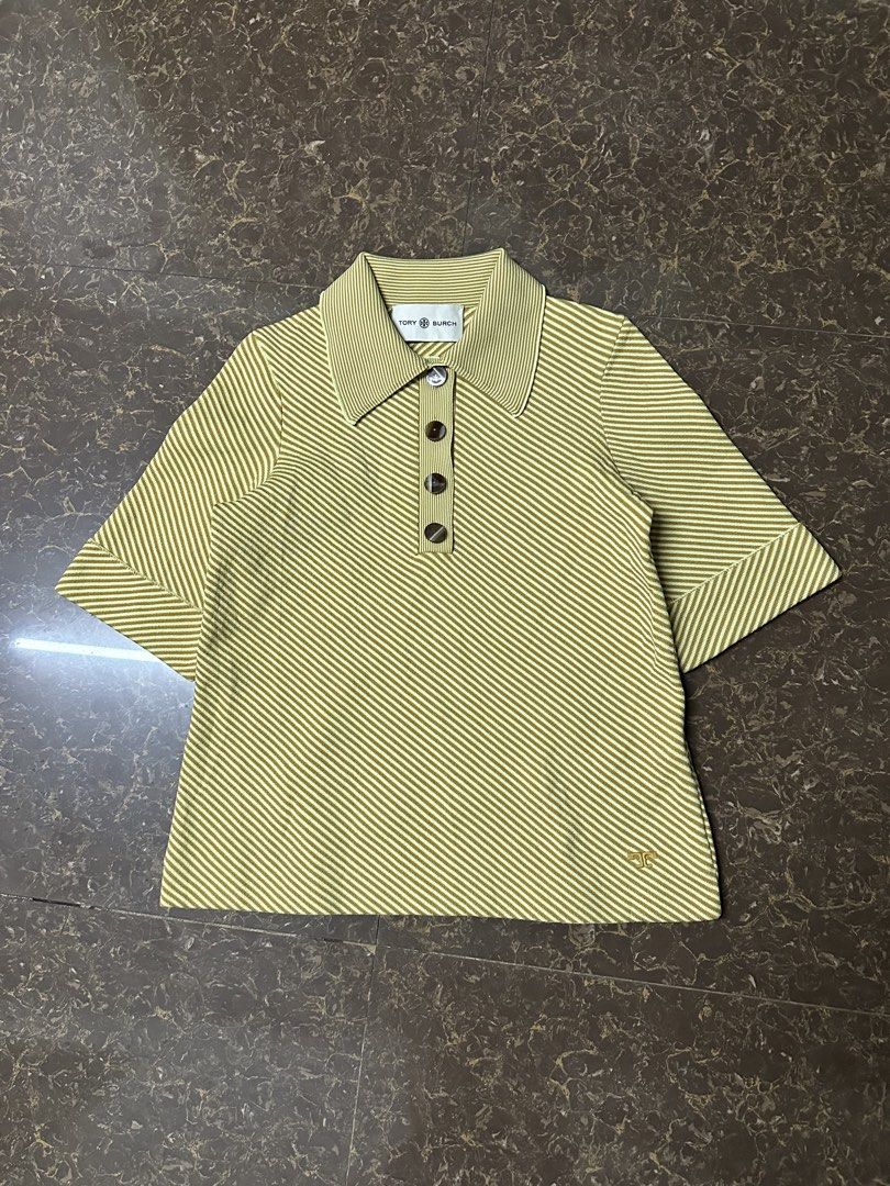 Tory Burch Striped Polo Shirt (Category: Shirts) located in Padada. Submitted by jevanie1234 (Listing ID 1462545136, Image 1). Description: - Tory Burch Polo Shirt - Size: XS - Design: Striped pattern - Features: Collar, button details - Branding: Embroidered Tory Burch logo on sleeve - Origin: Made in China.