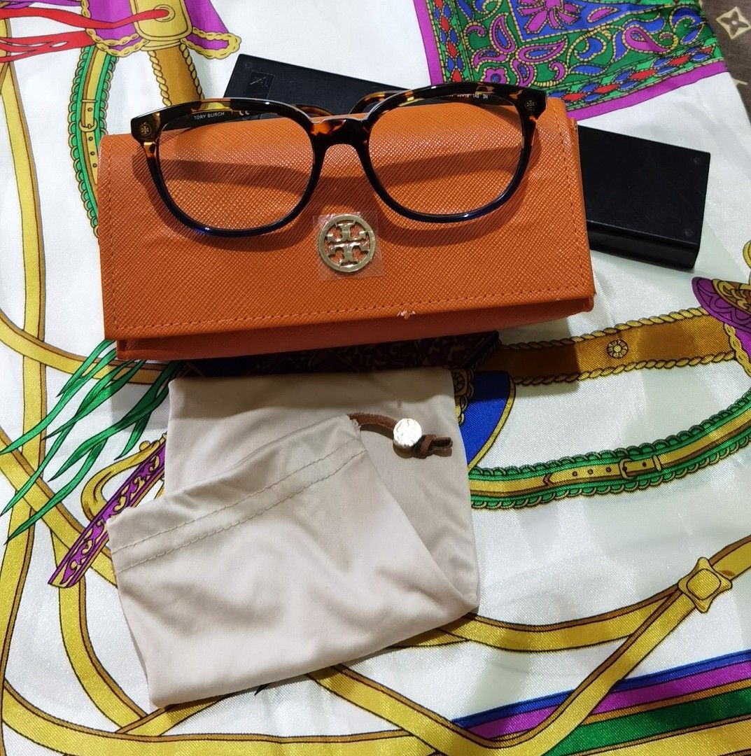 Tory Burch TY7131 Eyeglasses Frame (Category: Sunglasses & Eyewear) located in Cainta. Submitted by lupes.box (Listing ID 1462472436, Image 1). Description: - Brand: Tory Burch - Model: TY7131 - Authentic - Frame Color: Tortoiseshell with blue accents - Included Accessories: Soft pouch and hard case - Measurements: 55-18 140 - Lens can be changed to prescriptions lenses.