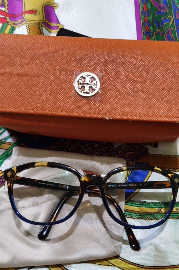 Tory Burch TY7131 Eyeglasses Frame (Category: Sunglasses & Eyewear) located in Cainta. Submitted by lupes.box (Listing ID 1462472436, Image 2). Description: - Brand: Tory Burch - Model: TY7131 - Authentic - Frame Color: Tortoiseshell with blue accents - Included Accessories: Soft pouch and hard case - Measurements: 55-18 140 - Lens can be changed to prescriptions lenses.