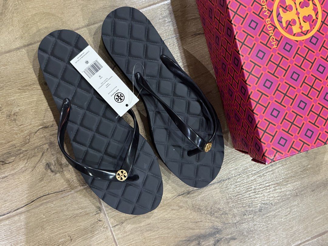 Tory Burch Willa Flip Flop Black (Category: Sneakers & Footwear) located in Quezon City. Submitted by eyabanana08 (Listing ID 1462602388, Image 3). Description: - Brand: Tory Burch - Model: Willa Flip Flops - Size: 8 - Color: Black - Features: Quilted footbed, shiny strap, with a bit of height - Embellishment: Gold Tory Burch logo on strap - Condition: Brand new, never worn - Includes: Original box.