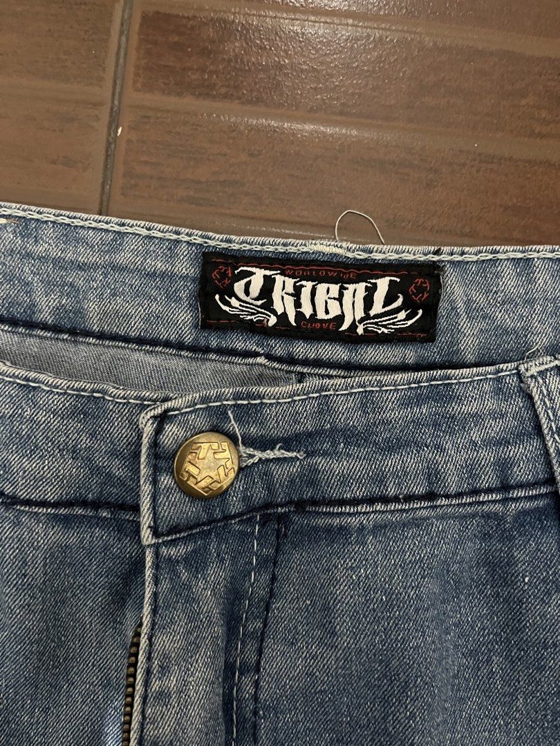 Tribal Worldwide Denim Jeans (Category: Jeans) located in Manila. Submitted by cypher05 (Listing ID 1462615799, Image 3). Description: - Brand: Tribal Worldwide - Style: Light wash denim jeans - Features: Classic five-pocket design, button and zip closure - Detail: Unique embroidered design on back pockets - Fit: Comfortable, perfect for casual wear.