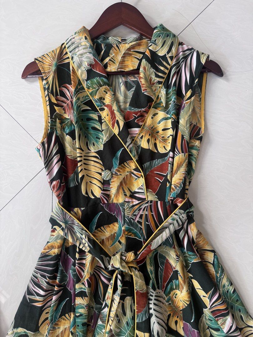 Tropical Leaf Dress (Category: Dresses) located in Paranaque City. Submitted by happymommy2828 (Listing ID 1462468532, Image 3). Description: -Used once only! -No issues -Side zipper, with belt Measurements: Length 46 1/2 inch Bust 18 1/2 inch Female on the photo stands 5’5..