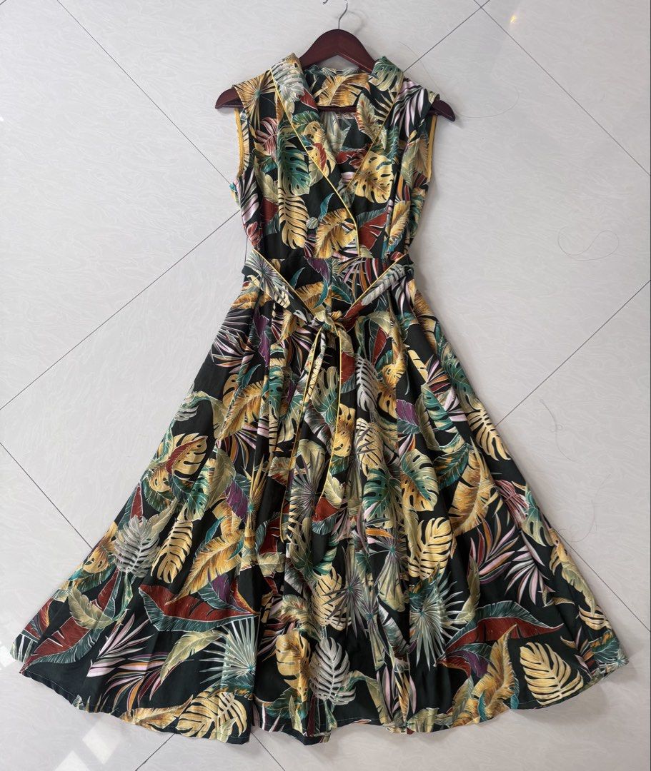 Tropical Leaf Dress (Category: Dresses) located in Paranaque City. Submitted by happymommy2828 (Listing ID 1462468532, Image 2). Description: -Used once only! -No issues -Side zipper, with belt Measurements: Length 46 1/2 inch Bust 18 1/2 inch Female on the photo stands 5’5..