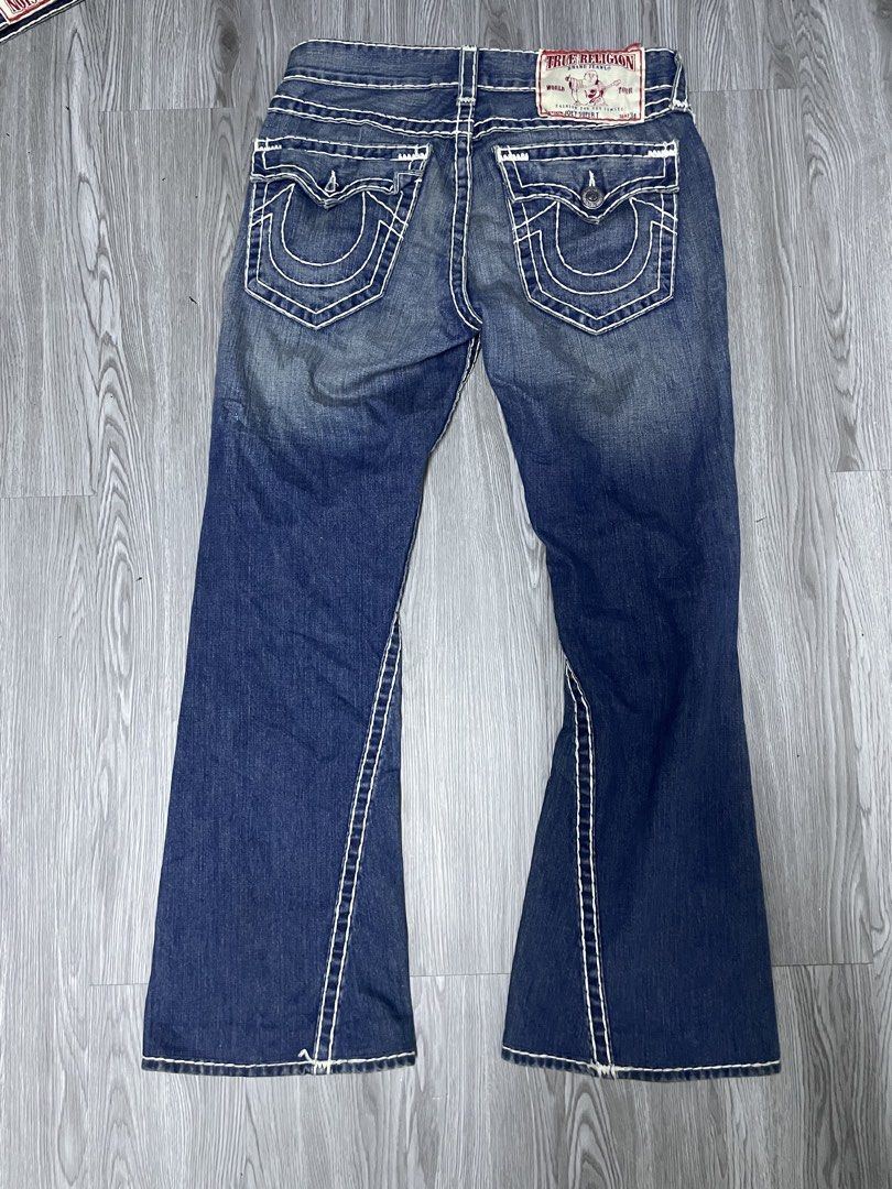 True Religion Flared Jeans White Stitching (Category: Jeans) located in Manila. Submitted by yourfavoriteplug (Listing ID 1462509063, Image 2). Description: - Classic True Religion jeans - Dark wash denim - Iconic white stitching - Flared leg style - Signature horseshoe design on back pockets - Versatile for any occasion.