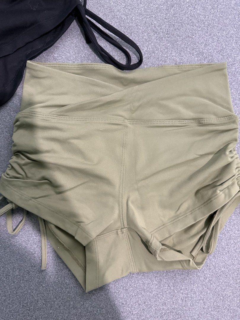 Two Ruched Drawstring Yoga Shorts (Black & Khaki) (Category: Shorts) located in Paranaque City. Submitted by prelovedbyysa (Listing ID 1462473455, Image 2). Description: - Ruched drawstring shorts - Available in Black and Khaki Green - High-waisted design - Adjustable side ties for a custom fit - Comfortable and stretchy material - Perfect for workouts SIZE SMALL NO FLAWS.