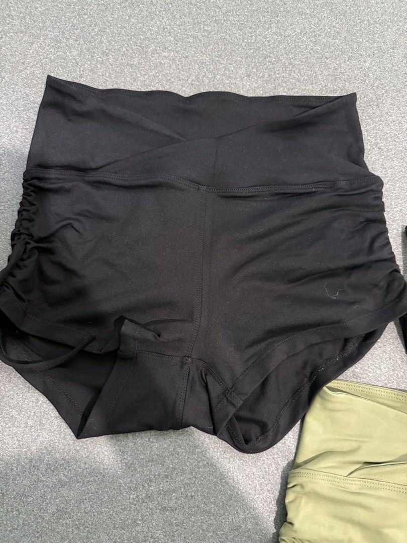 Two Ruched Drawstring Yoga Shorts (Black & Khaki) (Category: Shorts) located in Paranaque City. Submitted by prelovedbyysa (Listing ID 1462473455, Image 3). Description: - Ruched drawstring shorts - Available in Black and Khaki Green - High-waisted design - Adjustable side ties for a custom fit - Comfortable and stretchy material - Perfect for workouts SIZE SMALL NO FLAWS.